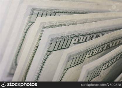 Hundred dollar bills in a row, back side, shallow depth of field