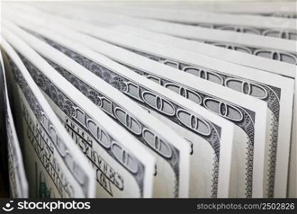 Hundred dollar bills in a row, shallow depth of field