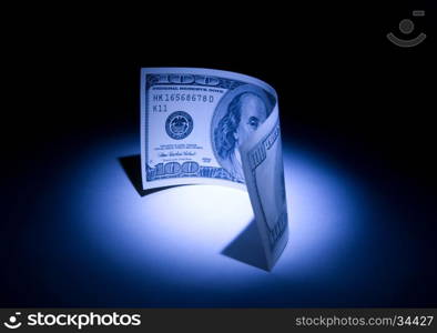 Hundred dollars. &#xA;Beautiful art illumination. A dark blue background.