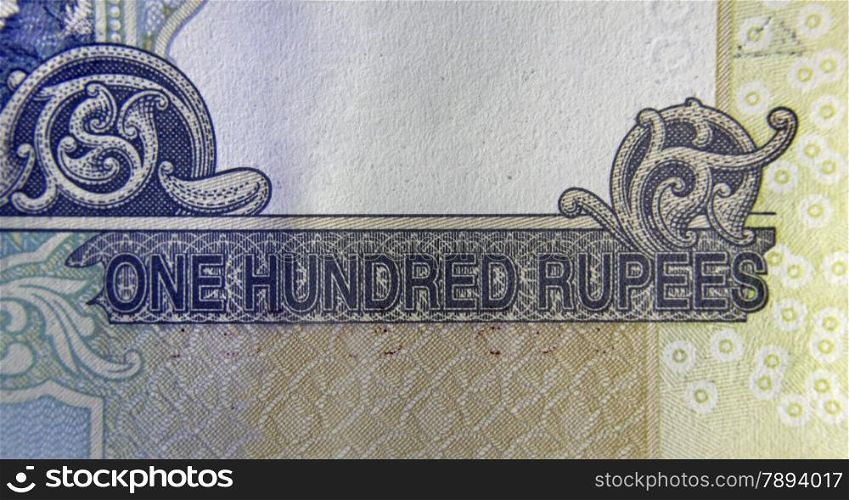 Hundred rupee written in English language on Hundred rupee banknote