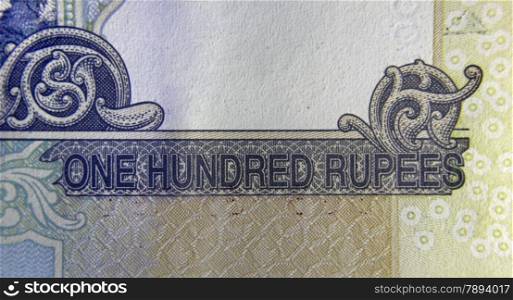 Hundred rupee written in English language on Hundred rupee banknote