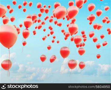Hundreds of the small red flying balloons