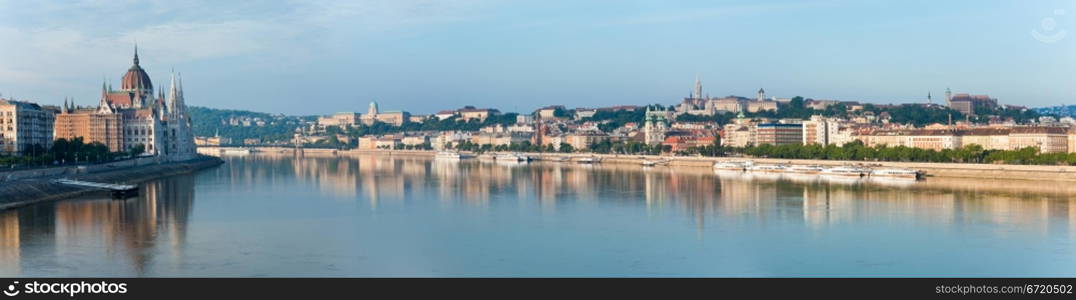 Hungarian landmark, Budapest Parliament (on the left). Morning view. Three shots stitch image.