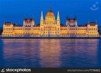 Hungarian Parliament Building along river Danube at night, seat of National Assembly of Hungary. Parliament Building along river Danube at night