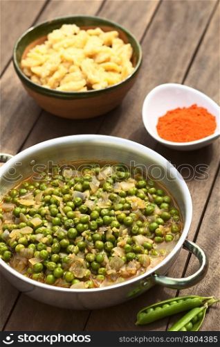 Hungarian peastew made of onion and peas and seasoned with paprika and salt, served usually with Hungarian galuska or nokedli (homemade noodles) (Selective Focus, Focus into the middle of the stew)