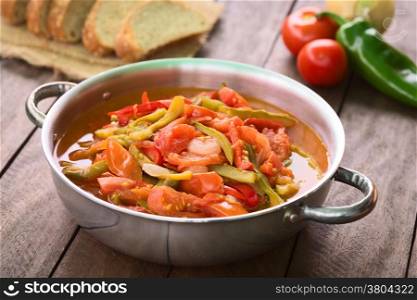 Hungarian traditional dish called Lecso, a vegetarian stew made of onion, pepper and tomato, seasoned with salt and pepper. It can be accompanied by bread or rice (Selective Focus, Focus in the middle of the dish)