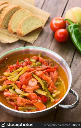 Hungarian traditional dish called Lecso, a vegetarian stew made of onion, pepper and tomato, seasoned with salt and pepper. It can be accompanied by bread or rice (Selective Focus, Focus in the middle of the dish)