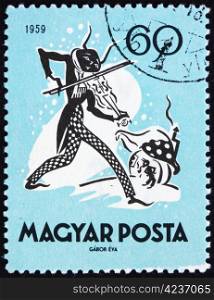 HUNGARY - CIRCA 1959: a stamp printed in the Hungary shows The Cricket and the Ant, Fairy Tale, circa 1959