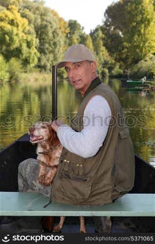 Hunter on a boat with his dog