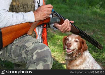 Hunter with dog and shotgun