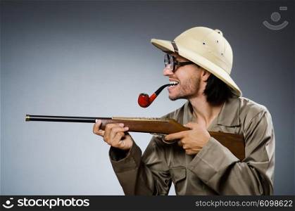 Hunter with rifle and smoking pipe