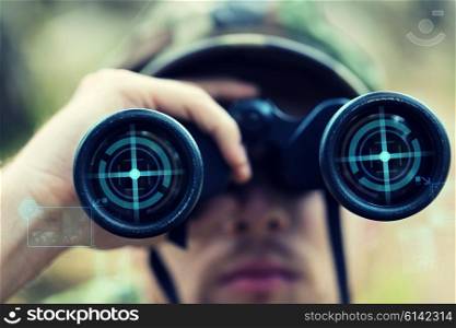 hunting, war, army and people concept - close up of young soldier, ranger or hunter with binocular and virtual projection observing forest