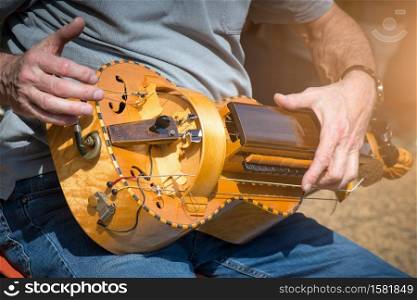 Hurdy-Gurdy Player outdoors