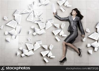 Hurrying businesswoman. Attractive businesswoman running with papers in hand