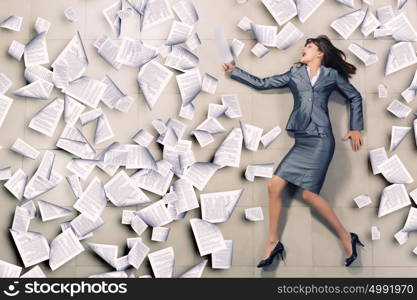 Hurrying businesswoman. Attractive businesswoman running with papers in hand