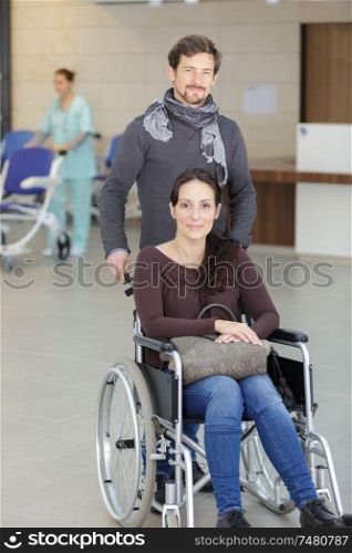 husband and patient sitting on a wheelchair