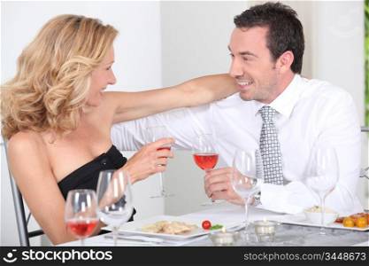 husband and wife enjoying romantic meal