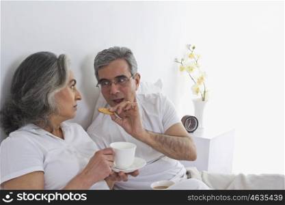 Husband and wife having tea