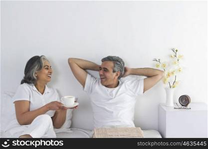 Husband and wife having tea
