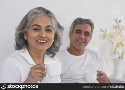 Husband and wife having tea