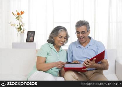 Husband and wife looking at a wedding album