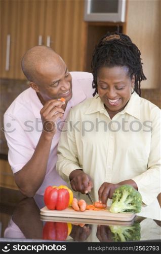 Husband And Wife Preparing A meal,mealtime Together