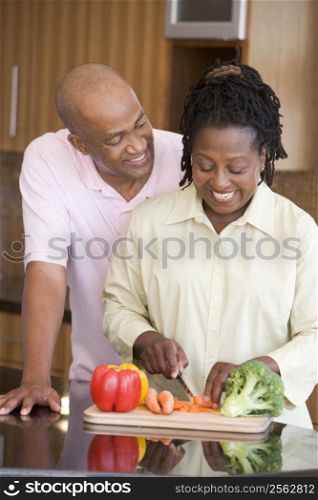Husband And Wife Preparing A meal,mealtime Together