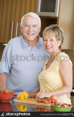 Husband And Wife Preparing Vegetables