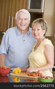 Husband And Wife Preparing Vegetables