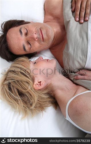 Husband and wife sleeping