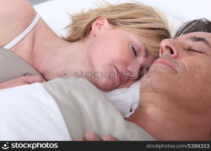 Husband and wife sleeping