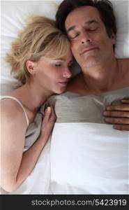 Husband and wife sleeping