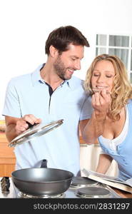 Husband cooking for wife