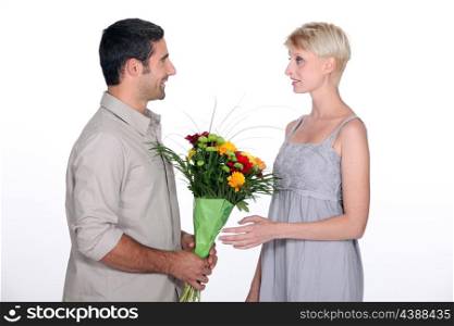 Husband giving wife flowers