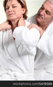Husband giving wife neck massage