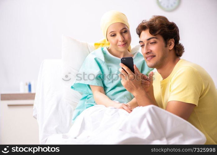 Husband looking after wife in hospital 