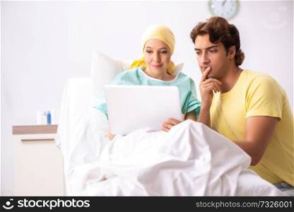 Husband looking after wife in hospital 