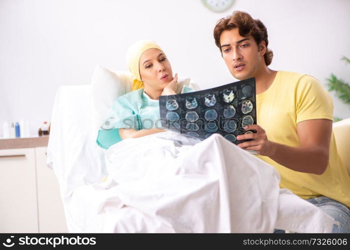 Husband looking after wife in hospital 