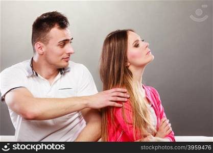 Husband trying to apologize wife. Disagreement.. Husband saying sorry trying to apologize wife after argument quarrel. Disagreement in relationship. Man and woman get mad.