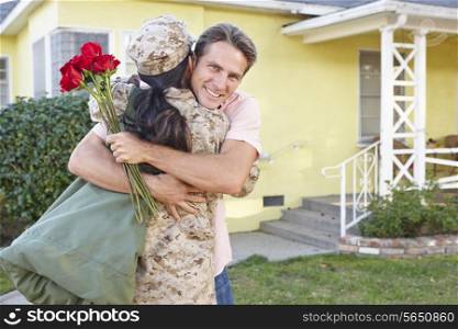 Husband Welcoming Wife Home On Army Leave
