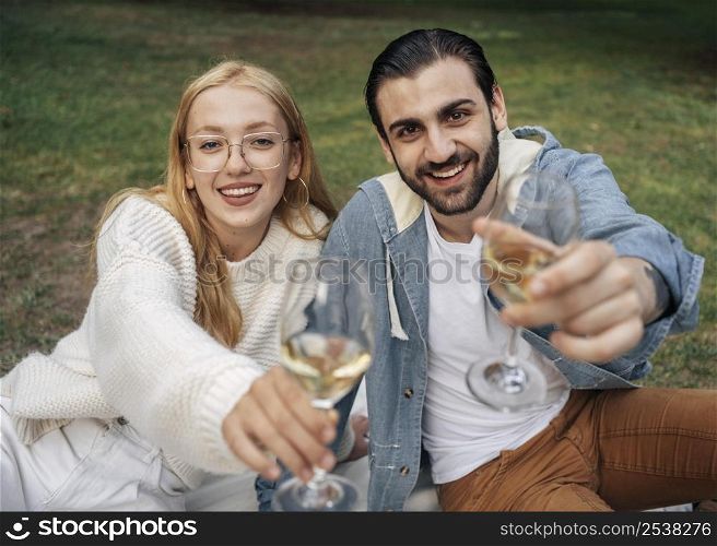 husband wife having picnic together outside