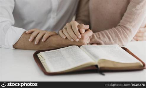 husband wife reading bible together. High resolution photo. husband wife reading bible together. High quality photo