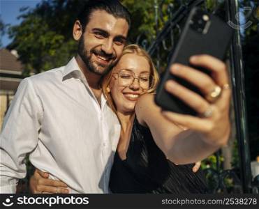 husband wife taking selfie