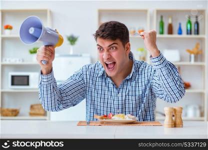 Husband with loudspeaker yelling at his wife