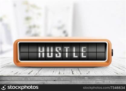 Hustle alarm on a wooden table in a bright room with a retro device