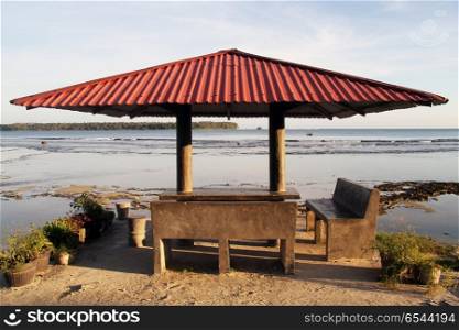 Hut under metal roof on the Pantai Sorak beach in Nias, Indonesia