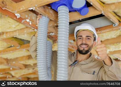 hvac technician ready to install ventilation system in house