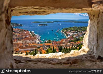 Hvar bay aerial view through stone window from Fortica fortress, Dalmatia, Croatia