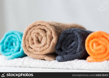 hygiene, fabric and textile concept - close up of bath towels