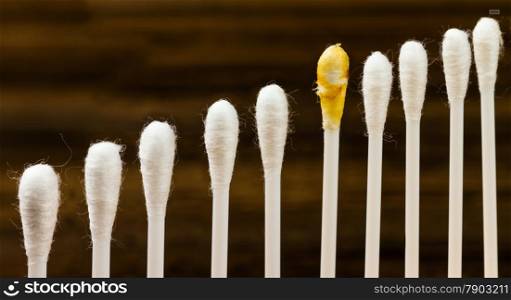 hygienic Q-tips isolated on wooden background